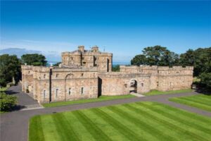 Seton Castle with blue sky and green lawn